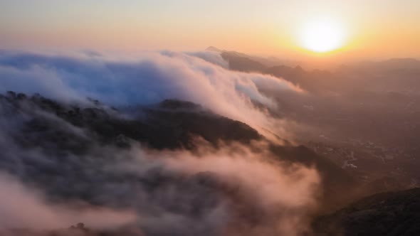  Aerial Time Lapse of Sunset and Cloud Waterfall Above the Mountains in Malibu