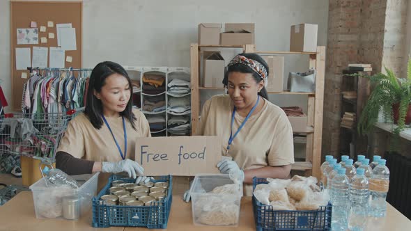 Portrait of Volunteers with Free Food for Charity