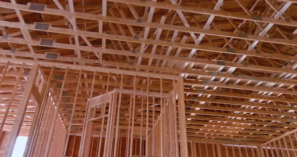 New Wooden Building with Wood Beams and Trusses Under Construction