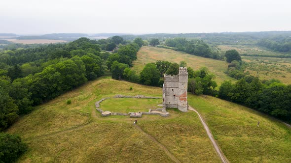 People on hilltop visiting Donnington medieval castle, Berkshire county, UK. Aerial circling