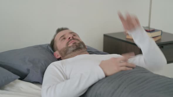 Man Unable to Sleep in Bed