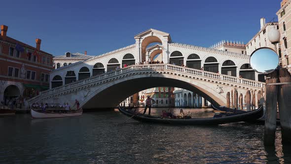 Traditional Gondolas on Narrow Canal in Venice Italy