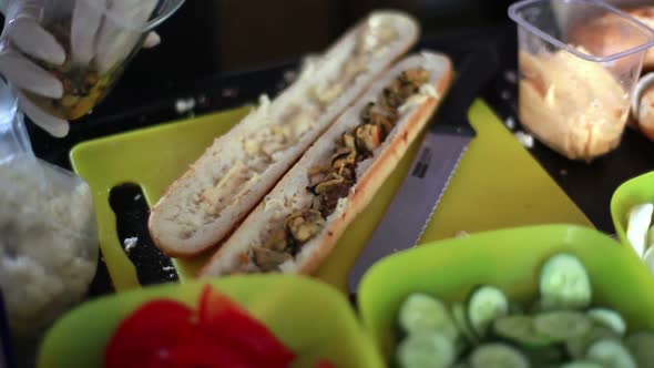 Cook Makes a Sandwich with a Seafood on Festival Street Food