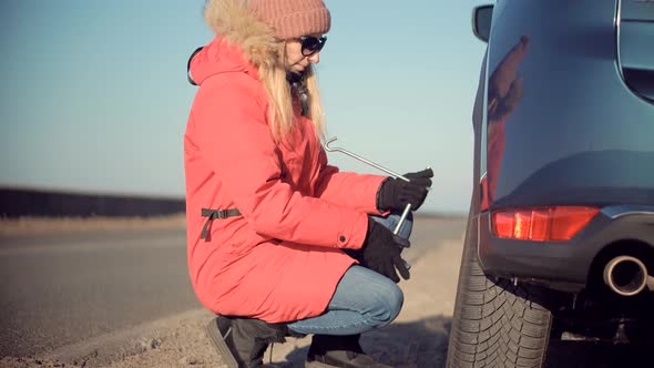 Woman Check Car Tire Pressure. Vehicle Trouble On Road On Vacation Trip. Female Trying Fix Car Tire.