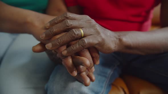 Closeup of Elderly Black Couple Holding Hands