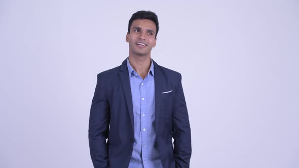 Young Indian Businessman in Suit Talking To Camera