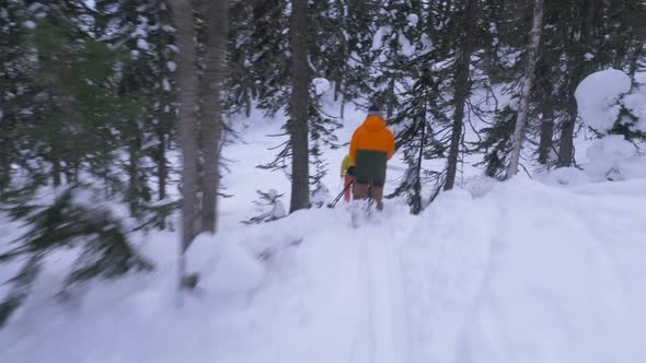 professional skiers practice free-ride along extreme track