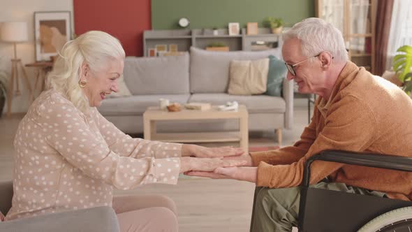 Senior Spouses Playing Slaps