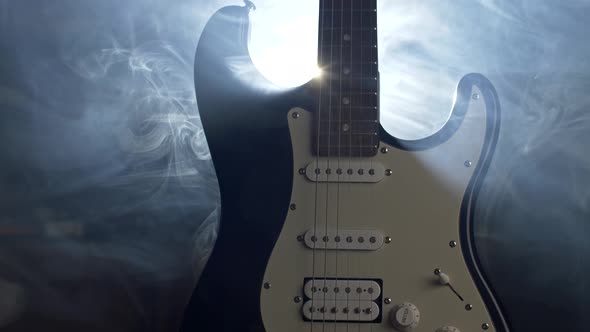 Electric Guitar on the Stage in Soffits Light and Smoke Before Rock Concert