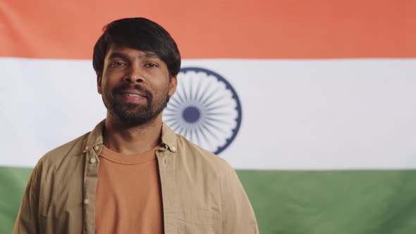 Indian Man Posing against National Flag