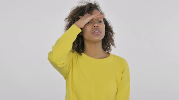 Young African Woman Looking Around Searching White Screen
