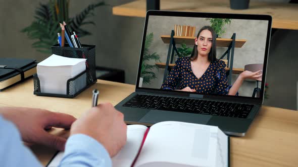 Smart beautiful woman tutor in laptop screen talk speak teaches by remote webcam
