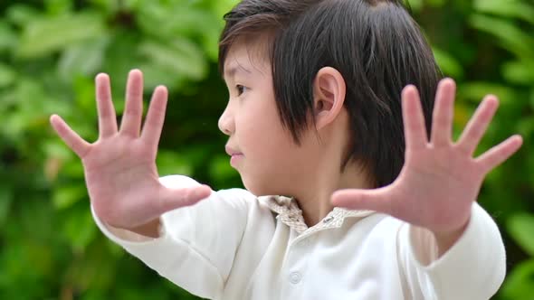 Asian Child Show Stop Hands Gesture For Stop