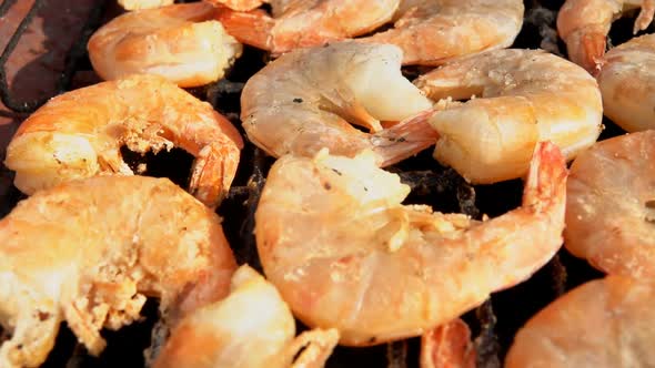 Closeup of Large Delicious Grilled Shrimps Roasting on the Grill Grid