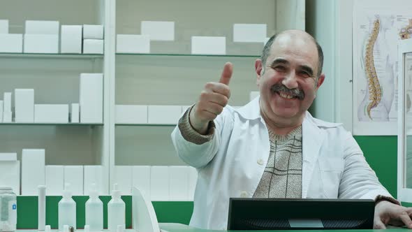 Happy Male Pharmacist Showing Allright Sign and Stumb Up Smiling