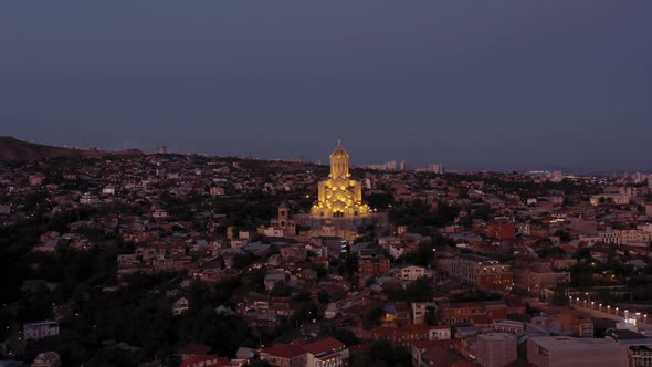 Aerial Drone Shot Zoom Out of Holy Trinity Church in Night, Tbilisi