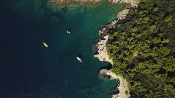 Mediterranean Coastline With Boats And Forest