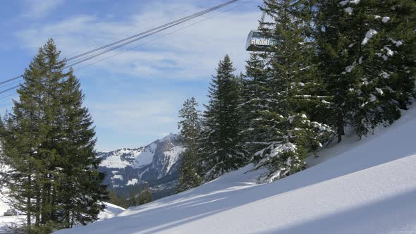 A cable car cabin in a winter scenery