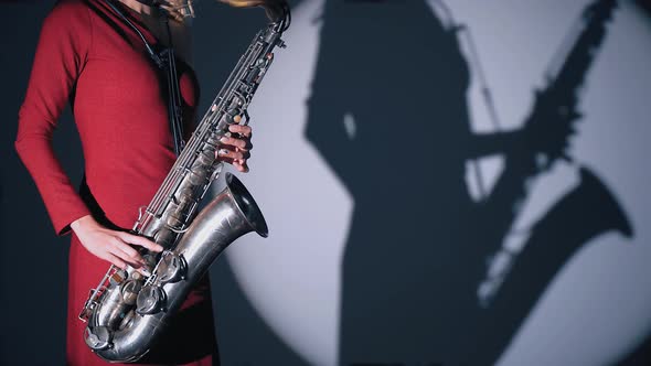 Woman Plays On Saxophone Jazz Melody