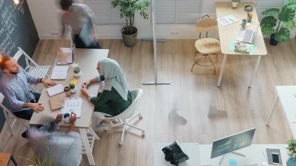 Time Lapse of Diverse Group of Employees Cooperating in Beautiful Creative Office Room