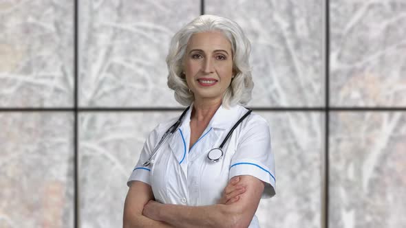 Portrait of Pretty Mature Doctor Looking at Camera