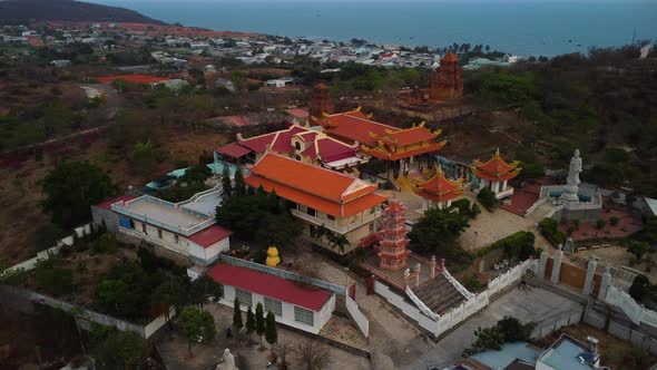 Aerial drone view of asian Buu Son precious buddhist temple at dusk. Vietnam attraction