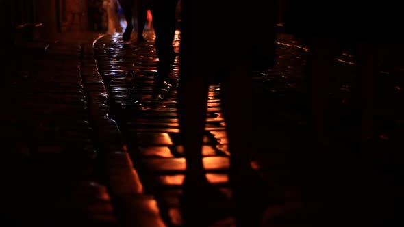 Dark Street and People Walking By