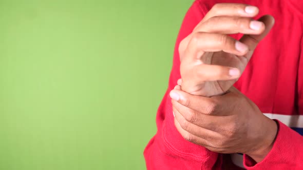 Man Suffering Pain Hand Green Background