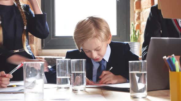 Blonde Clever Leader Analizing Contracts While Sitting at Workplace