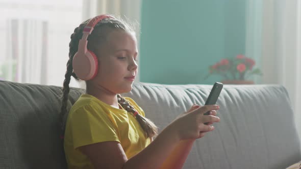 Girl Is Using Gadget To Surf in the Internet