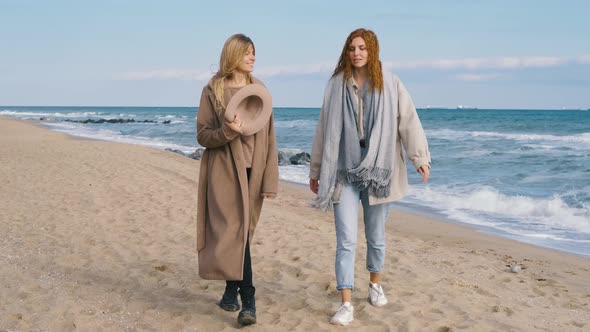 Beautiful Girls Walk Near the Sea