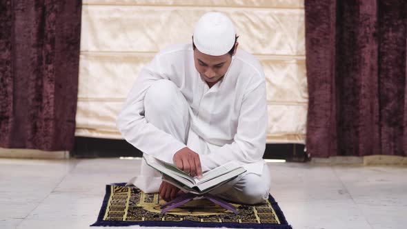 Muslim man learning Quran