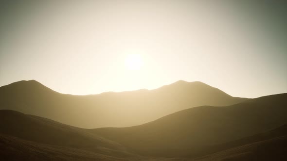 Hills with Rocks at Sunset