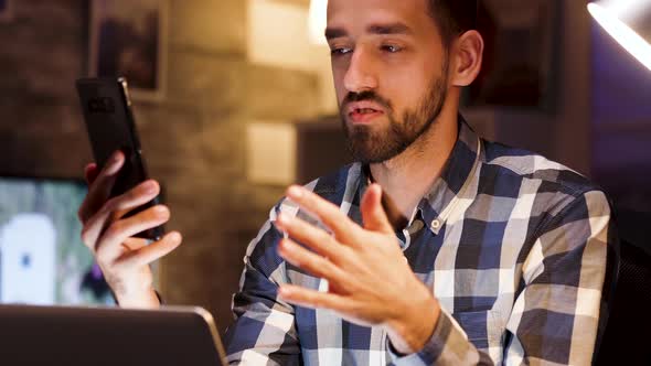 Businessman Giving Explanations During a Video Call