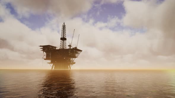 Offshore Jack Up Rig in The Middle of The Sea at Sunset Time