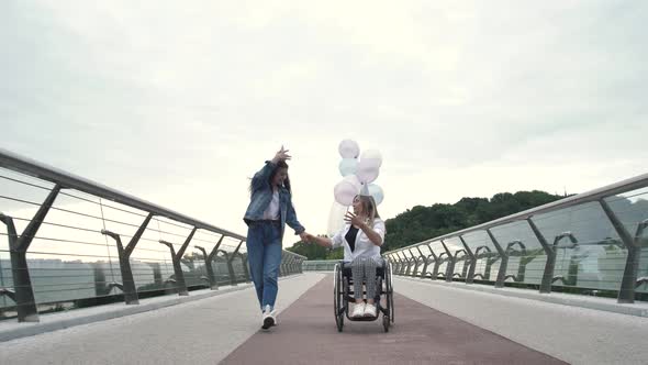 Joyful Birthday Girl with Disabled Mom Outdoors