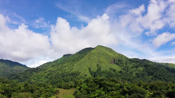 Tropical Landscape, Mountain Top and Blue Sky with Clouds