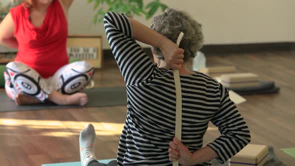 Woman Doing Stretch Exercise with Band