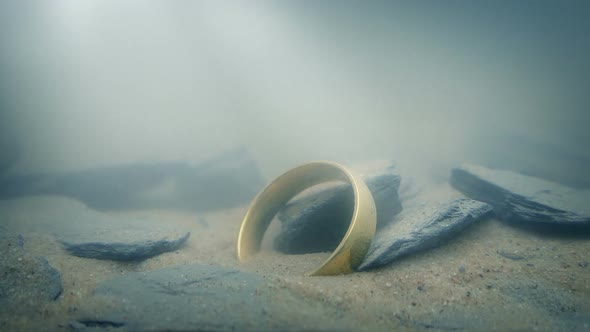 Ring On Lake Floor In Sun Rays