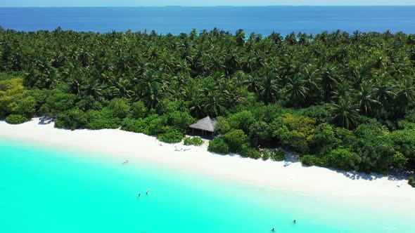 Tropical birds eye clean view of a white sand paradise beach and blue water background in colorful 4