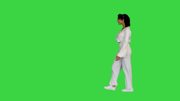 African American Girl Walking Happily on a Green Screen Chroma Key