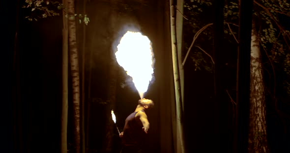 Male Circus Actor Is Creating Mist of Fuel From Mouth and Burning It By Torch