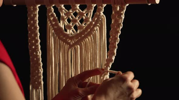 Woman Weaves Pattern of Macrame Threads with Her Own Hands for Decoration or Home Decor