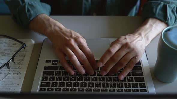 Man Hands Top View Typing on Laptop Keyboard