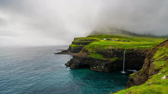 Timelapse of Sunset at Mulafossur Waterfall and Gasadalur Village