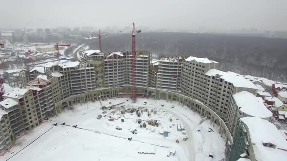 Aerial View of an Empty Building Construction Zone in a Winter Scenery