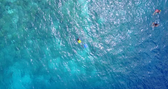 Tropical drone clean view of a paradise sunny white sand beach and aqua blue water background 