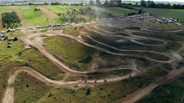 Aerial View of Motorcycle Riders on a Sandy Road. Outdoor Motor Sport From Drone View.