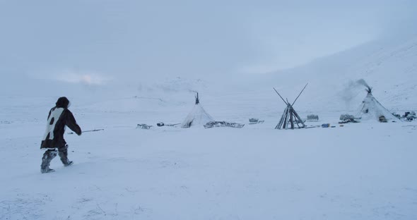 Walking Man in Arctic To the Yurts Camp , He Have