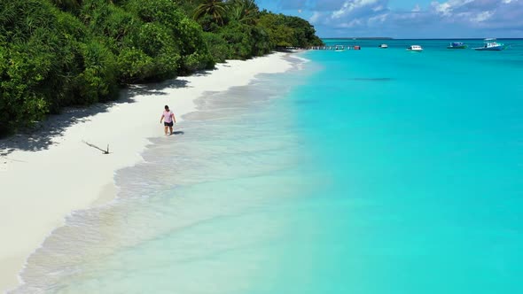 Single lady tans on idyllic tourist beach lifestyle by blue ocean and white sand background of the M